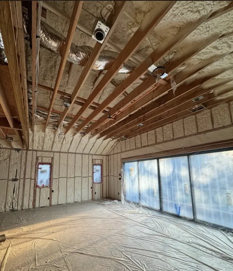 Interior walls and ceiling insulated with spray foam during new construction in Ormond-by-the-Sea